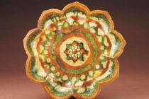 唐三彩在唐朝兴起的原因是什么